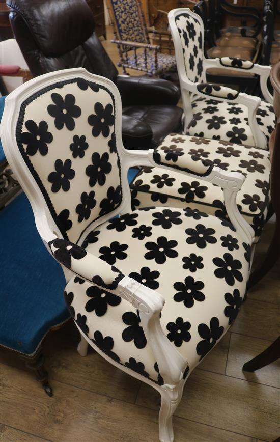 Two spotted armchairs and a foot stool